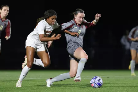 Sam SMith battles for the ball against Virginia