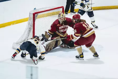 Abigail Levy makes a save against Merrimack.