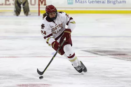 Caroline Goffredo carries the puck over the blue line.