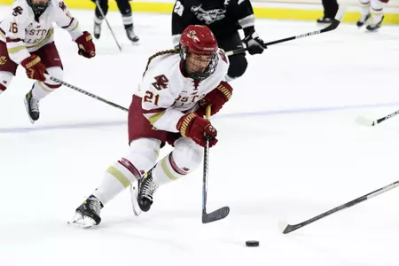 Abby Newhook skates the puck up the ice against Providence.