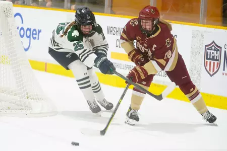 Kelly Browne battles for the puck against Mercyhurst.