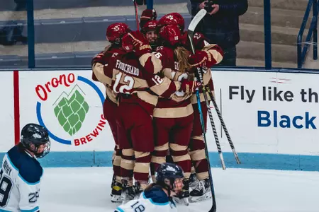 The Eagles celebrate Hannah Bilka's first goal against Maine.