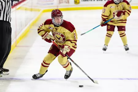 Natalie Tulchinsky carries the puck up the ice against UConn.
