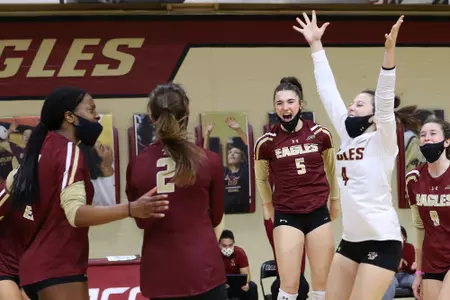 Sophia Lambros and Anna Murphy celebrate a point vs. Notre Dame.