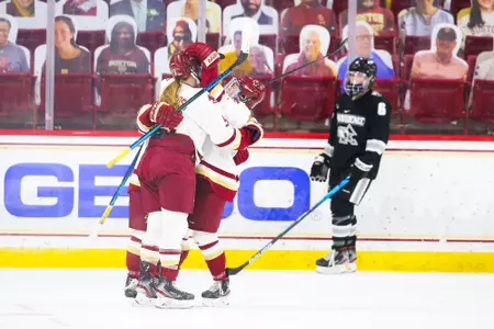 The Eagles celebrate Cayla Barnes' winning goal against Providence.