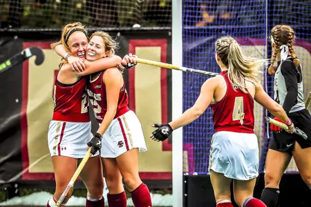 Margo Carlin and Elizabeth Warner hug following a goal