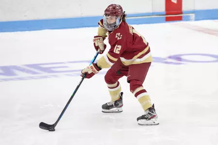 Olivia Finocchiaro carries the puck up the ice against BU.
