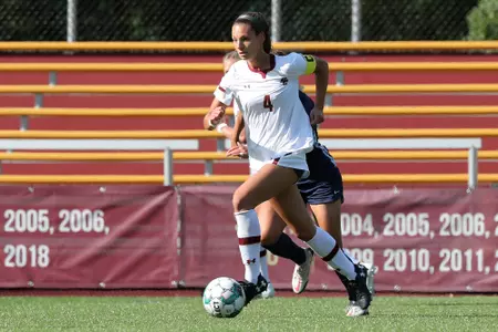 Jenna Bike carries the ball across the field against UNC.
