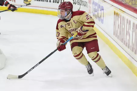 Cayla Barnes looks to rush the puck up the ice.