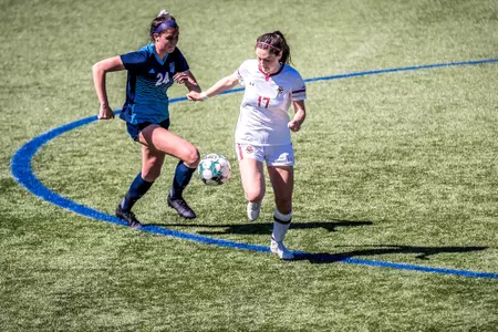 Nye Day goes for the ball against Rhode Island.