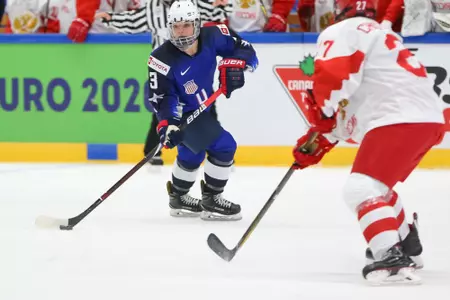 Cayla barnes skates the puck up the ice at the 2019 world championships.