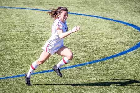 Mia Karras sprints across the field against Rhode Island.