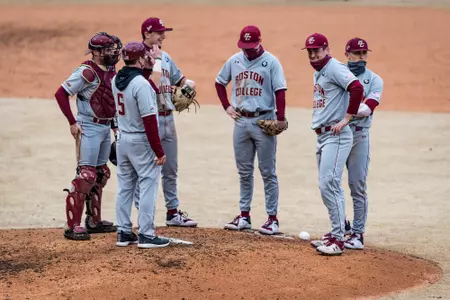 Baseball infielder around the mound during a pitching change at Duke.