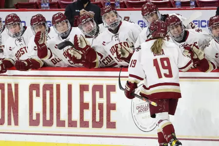 Hannah Bilka celebrates a goal by skating down the bench.