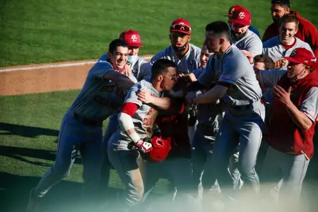 Sal Frelick is mobbed at home after a game-tying home run at Auburn.