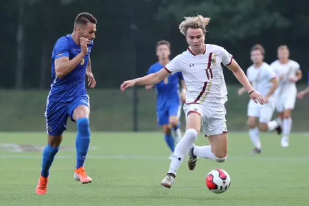 Michael Suski dribbles the ball up the field against Pitt.