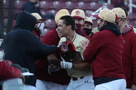 Cameron Leary is greeted in the dugout after a home run vs. Maine