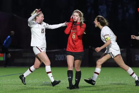 Alison Heckman and Jenna Bike celebrate Heckman's goal against Northeastern.