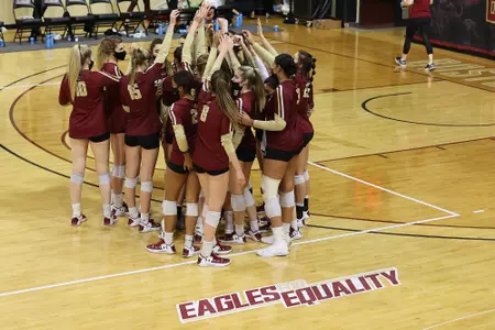 Volleyball team huddles postgame vs. Virginia Tech