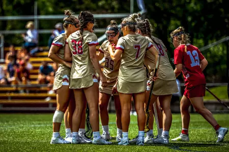 Lacrosse team in a huddle