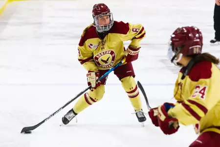 Hadley Hartmetz shoots the puck into the zone.