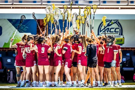 Lacrosse team in a huddle
