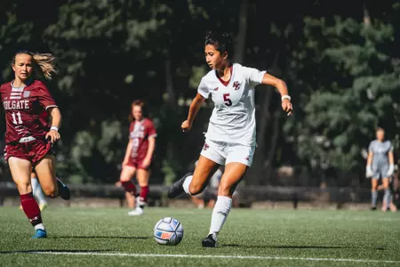 Sonia Walk kicks the ball up field against Colgate.