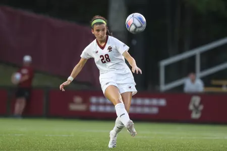 Sarai Costello kicks the ball up the field.