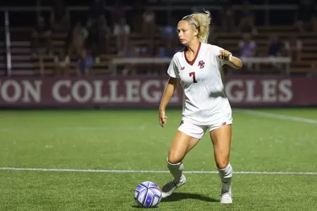 Zoie Allen takes the ball up the field against Boston University.