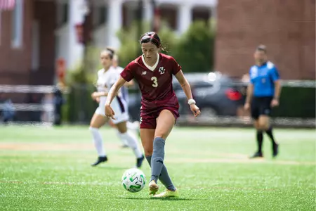 Haley Thomas dribbles the ball up the field against Iona.