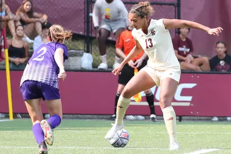Linda Boama takes on a Holy Cross player.