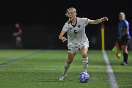 Éabha O'Mahony takes the ball up the field against BU.