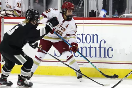 Olivia Finocchiaro dumps the puck in against Providence.
