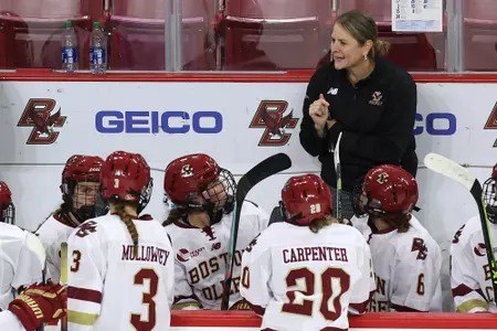Head coach Katie Crowley on the bench against Maine.