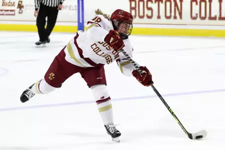 Kelly Browne shoots the puck.