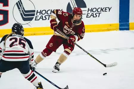 Hannah BIlka carries the puck up the ice at UConn.