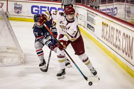 Willow Corson carries the puck behind the net against UConn.