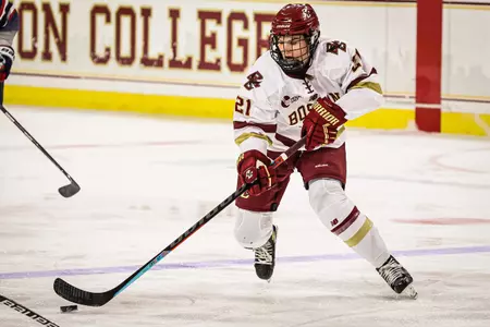 Abby Newhook carries the puck up the ice against UConn.