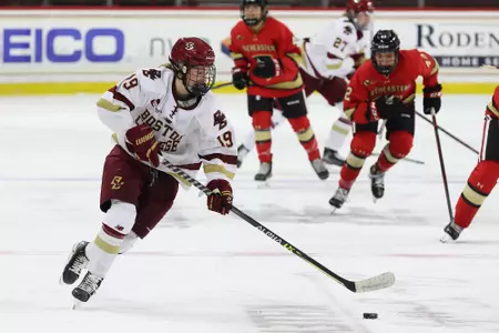 Hannah Bilka carries the puck up the ice against Northeastern.