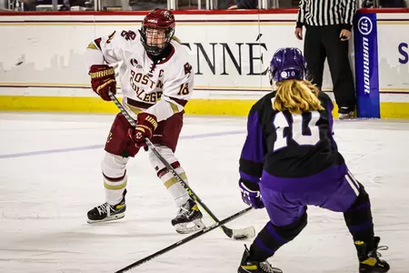 Kelly Browne looks to make a pass against Holy Cross.