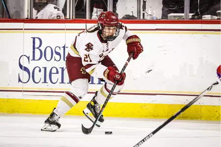 Abby Newhook skates the puck up the ice against Holy Cross.