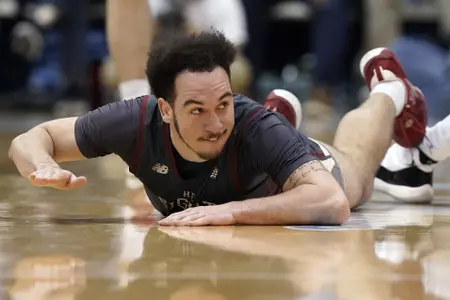 Boston College guard Jaeden Zackery slaps the court following a play during the second half of an NCAA college basketball game against North Carolina in Chapel Hill, N.C., Wednesday, Jan. 26, 2022. (AP Photo/Gerry Broome)