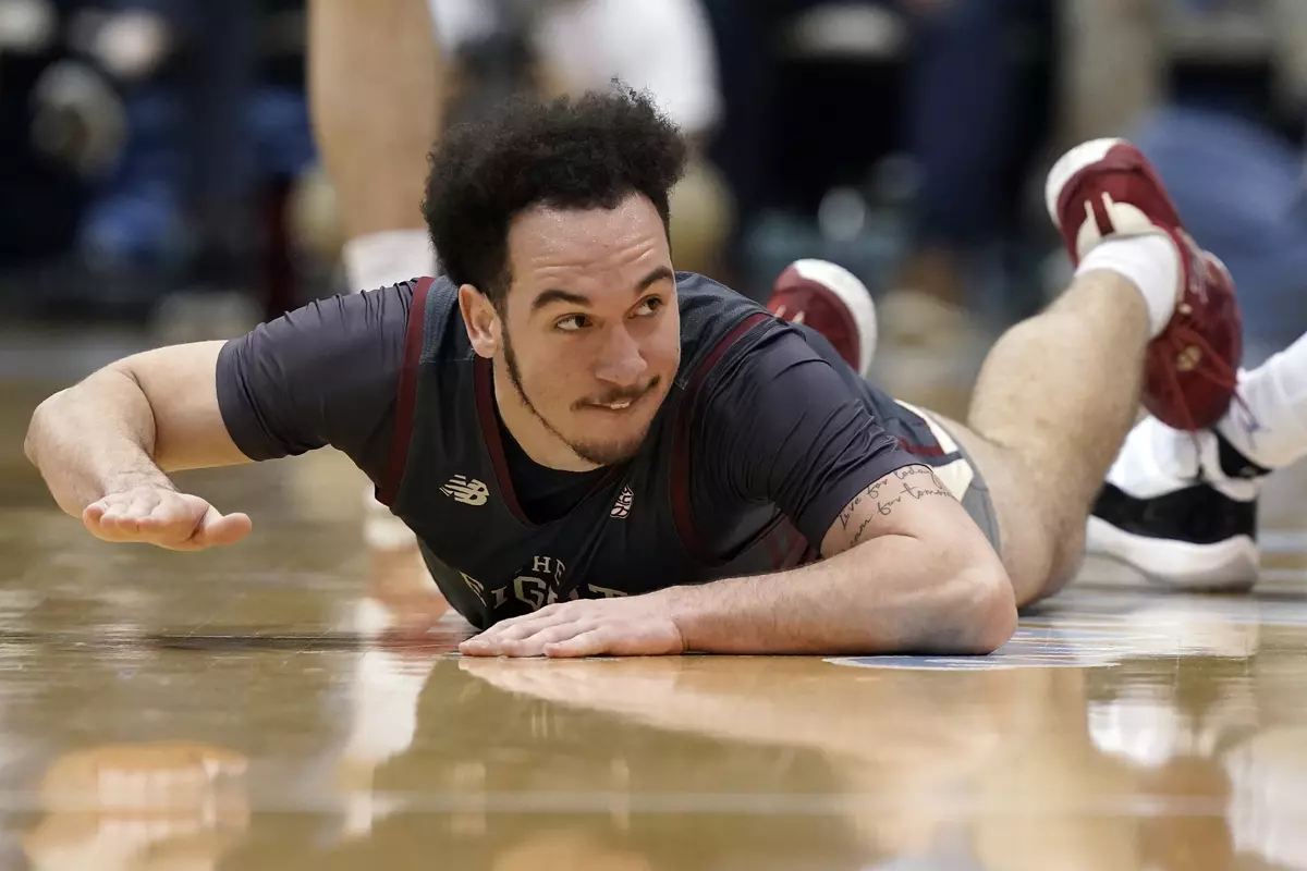 Boston College guard Jaeden Zackery slaps the court following a play during the second half of an NCAA college basketball game against North Carolina in Chapel Hill, N.C., Wednesday, Jan. 26, 2022. (AP Photo/Gerry Broome)