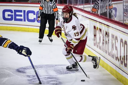 Hannah Bilka moves the puck behind the net against Merrimack.