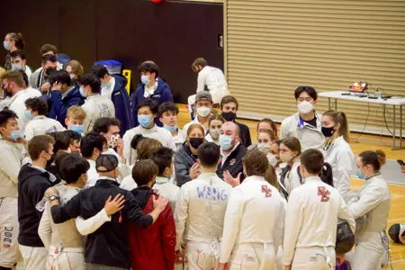 BC Fencing huddles before meet