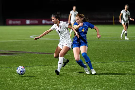 Sonia Walk battles for the ball against PItt.