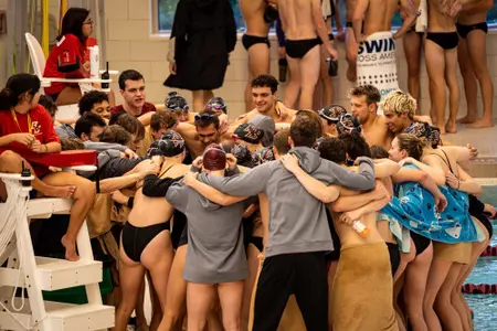 BC Men's and Women's team pre-meet huddle