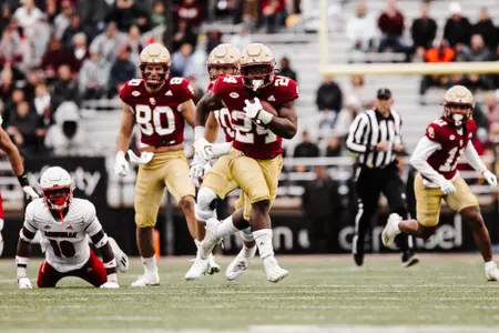 Pat Garwo rushes into the open field against Louisville