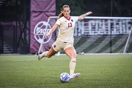 Claire Mensi kicks the ball up the field against Florida State.