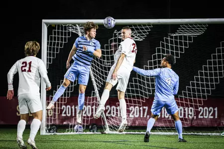 Stefan Sigurdarson goes for a header against UNC